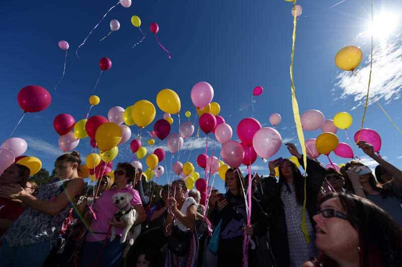 Mourners release balloons at a community vigil for murdered 14 month old Sanaya Sahib at Darebin creek, Heidelberg West, Friday, April 15, 2016. 