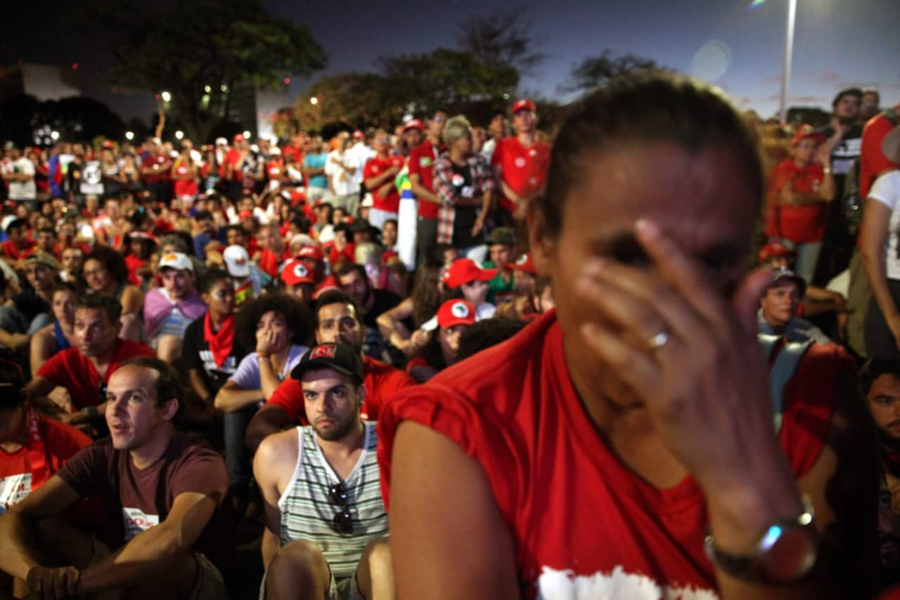 Hundreds of people watch a screen displaying the Chamber of Deputies' discussion, at Paulista Avenue in Sao Paulo, Brazil, 17 April 2016. 