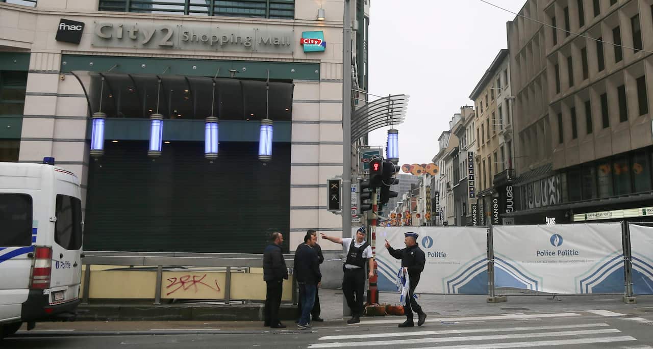 Police officers block the access to City 2 shopping mall during an anti-terrorist operation in Brussels, Belgium