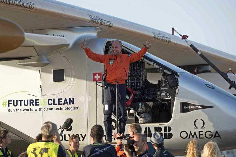 Pilot Bertrand Piccard, celebrates after landing the solar-powered plane at San Pablo airport in Seville, Spain.