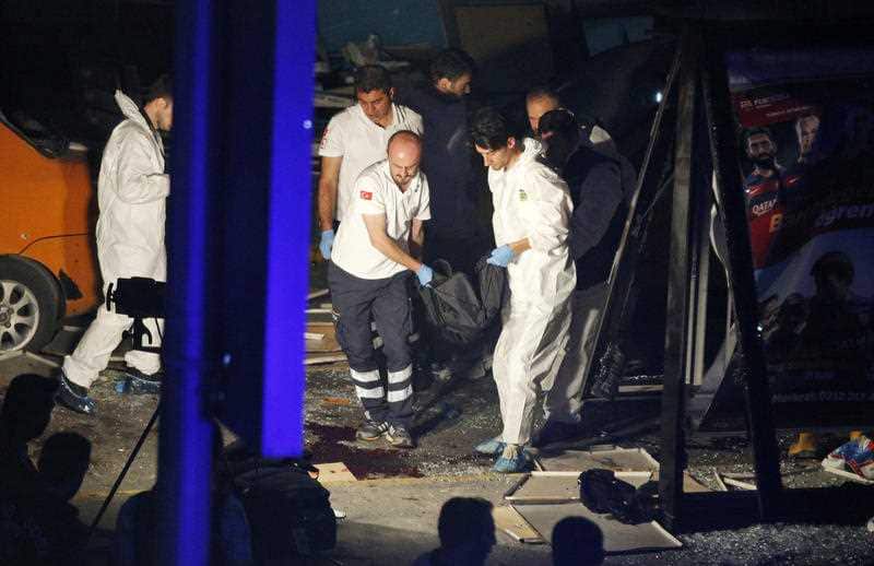 Turkish rescue services carry a victim from the scene of a blast outside Istanbul's Ataturk airport