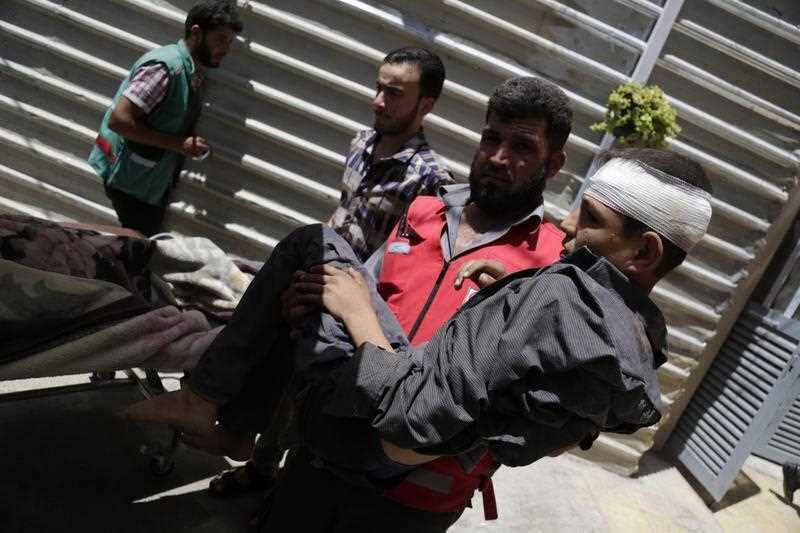 Abdulmonam Eassa's photo of an injured boy arriving at hospital in Eastern Ghouta. 