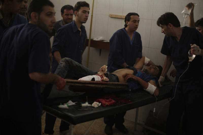 Abdulmonam Eassa's photo of an injured man arriving at hospital in Eastern Ghouta. 