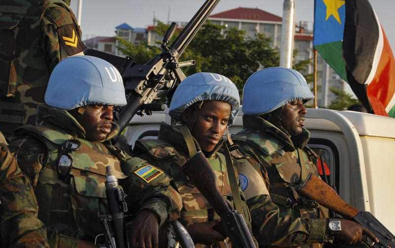 United Nations peacekeepers from Rwanda wait to escort members of the UN Security Council as they arrive at the airport in the capital Juba, South Sudan