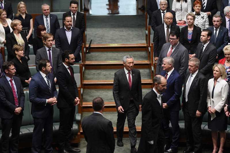 Prime Minister of Singapore Lee Hsien Loong (centre) arrives to address Australian MPs and Senators in the House of Representatives at Parliament House