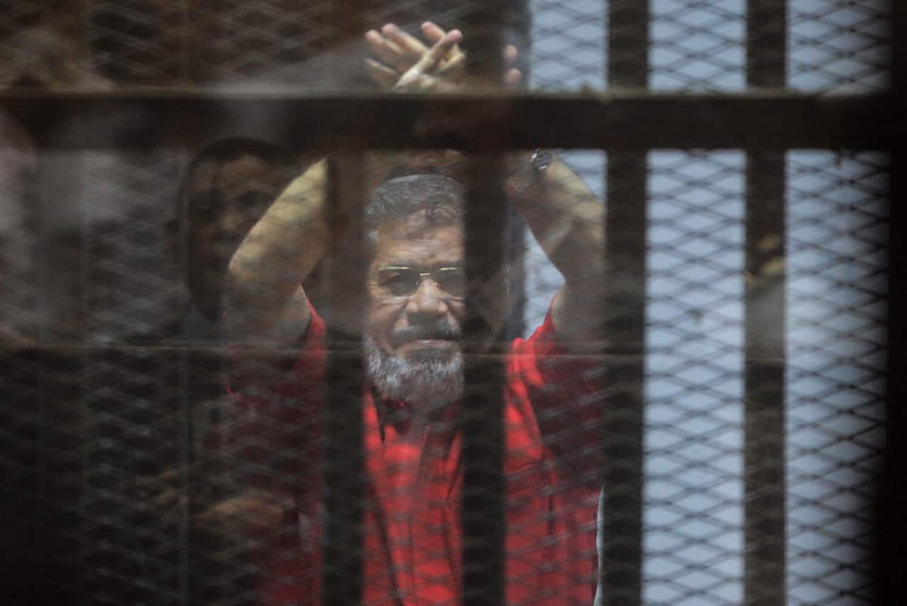 Ousted Egyptian President Mohamed Morsi looks on during a trial on charges of espionage in Cairo.