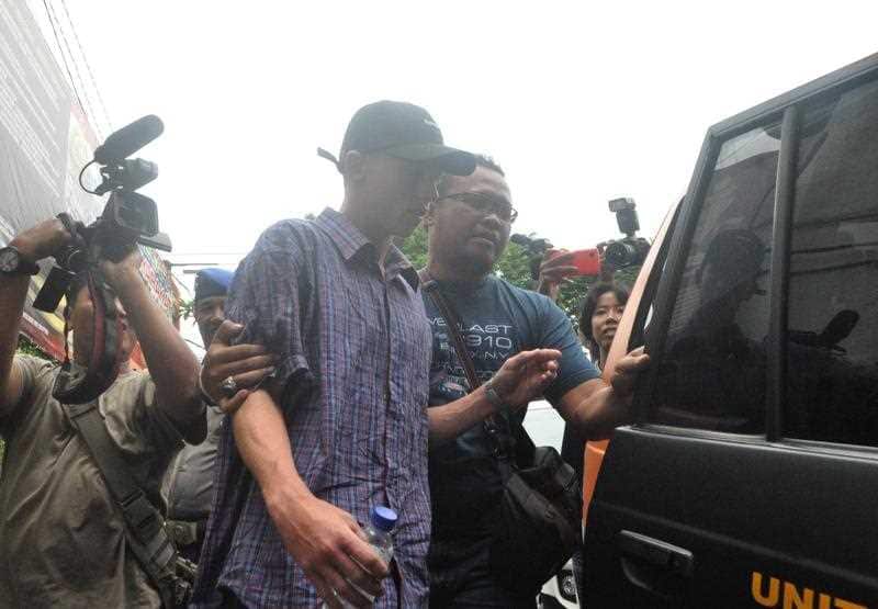Australian teenager Jamie Murphy is escorted at Kuta police station, Bali, Indonesia, Tuesday, Nov. 22, 2016.