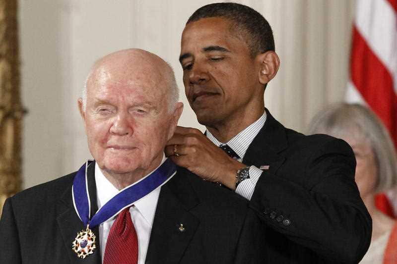 In this 2012 file photo, President Barack Obama awards the Medal of Freedom to former astronaut John Glenn during a ceremony in the White House