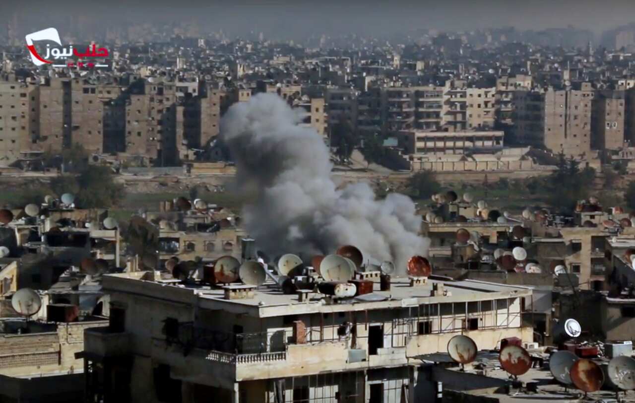 This frame grab from video provided by the Aleppo News Network, shows smoke rising following an air strike that hit insurgents positions in Aleppo, Syria.