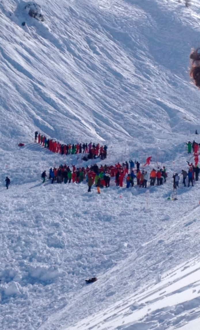 In this image made available by Victor Diwisch rescue personnel work at the site of an avalanche at Lavachet Wall in Tignes, France, Monday Feb. 13, 2017.