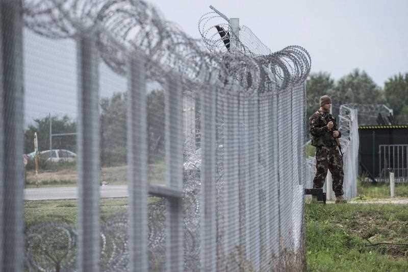 Hungarian soldier patrols at the transit zone at Hungary's southern border with Serbia