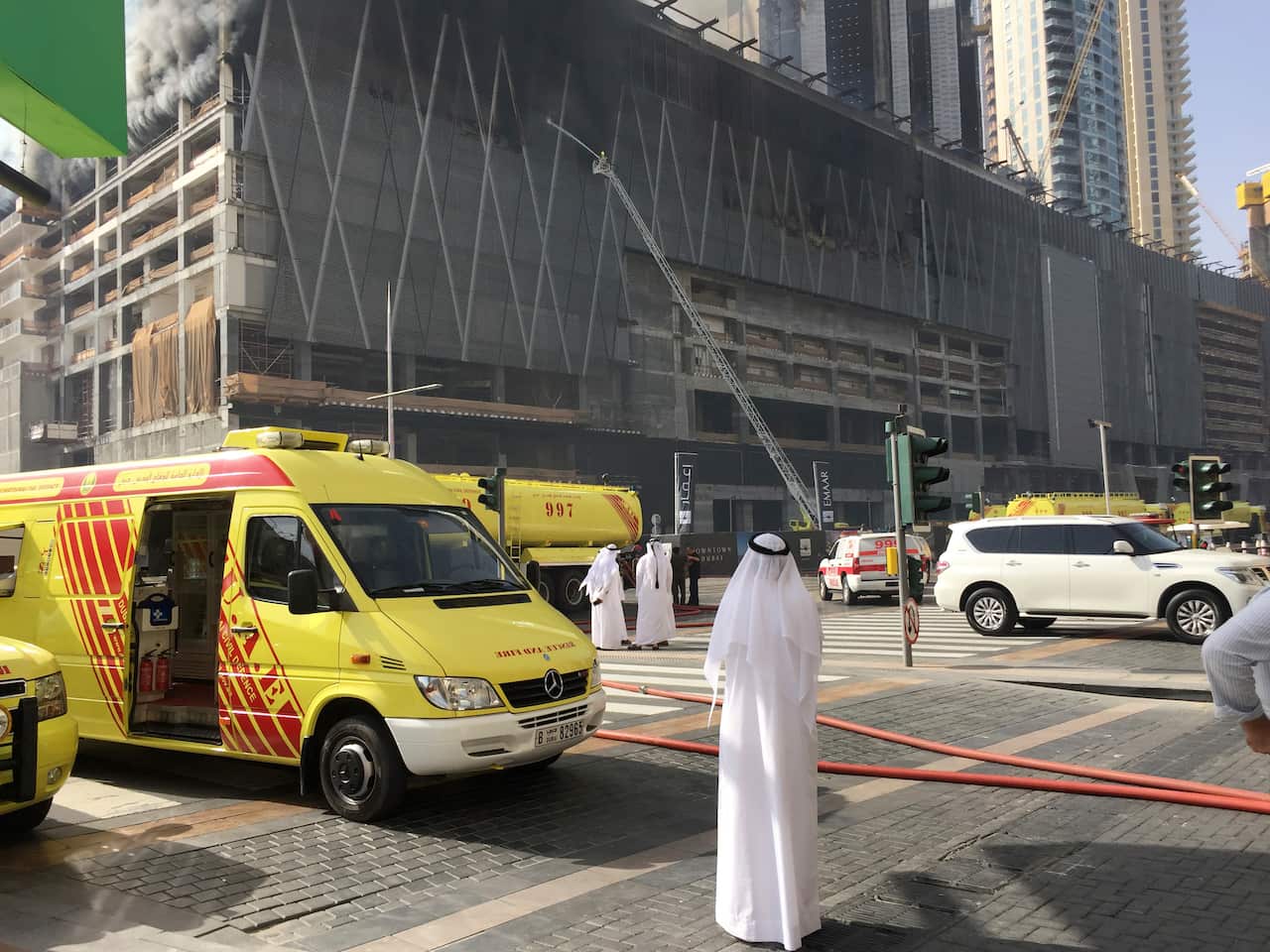An Emirati watches a fire at an under-construction tower in Dubai.