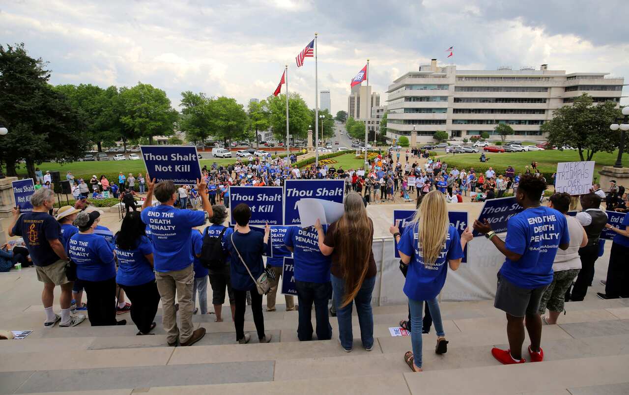 Crowds gather at a rally on the front steps of Arkansas' Capitol on Friday.