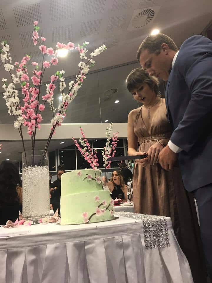 A supplied image of Newcastle Knights player Trent Hodkinson (right) with terminally ill teenager Hannah Rye to her Year 10 formal at Kurri Kurri High School