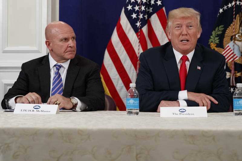 National Security Adviser H.R. McMaster listens as President Donald Trump speaks to reporters after a security briefing in August, 2017.