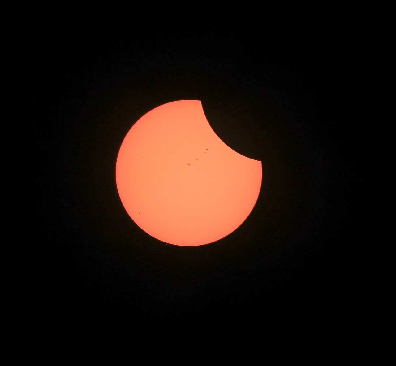 The moon starts its path across the sun before the start of a total solar eclipse