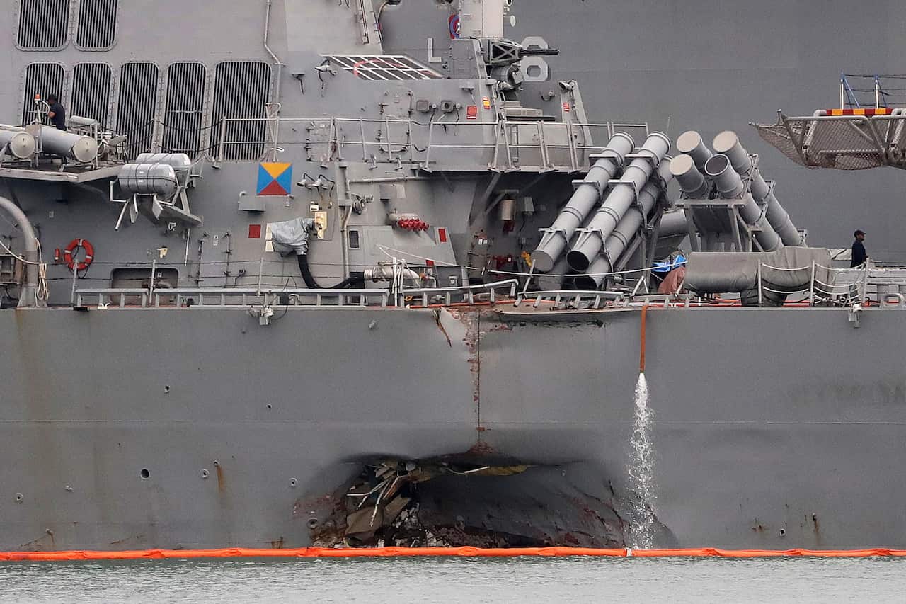 The damaged port aft hull of USS John S. McCain.