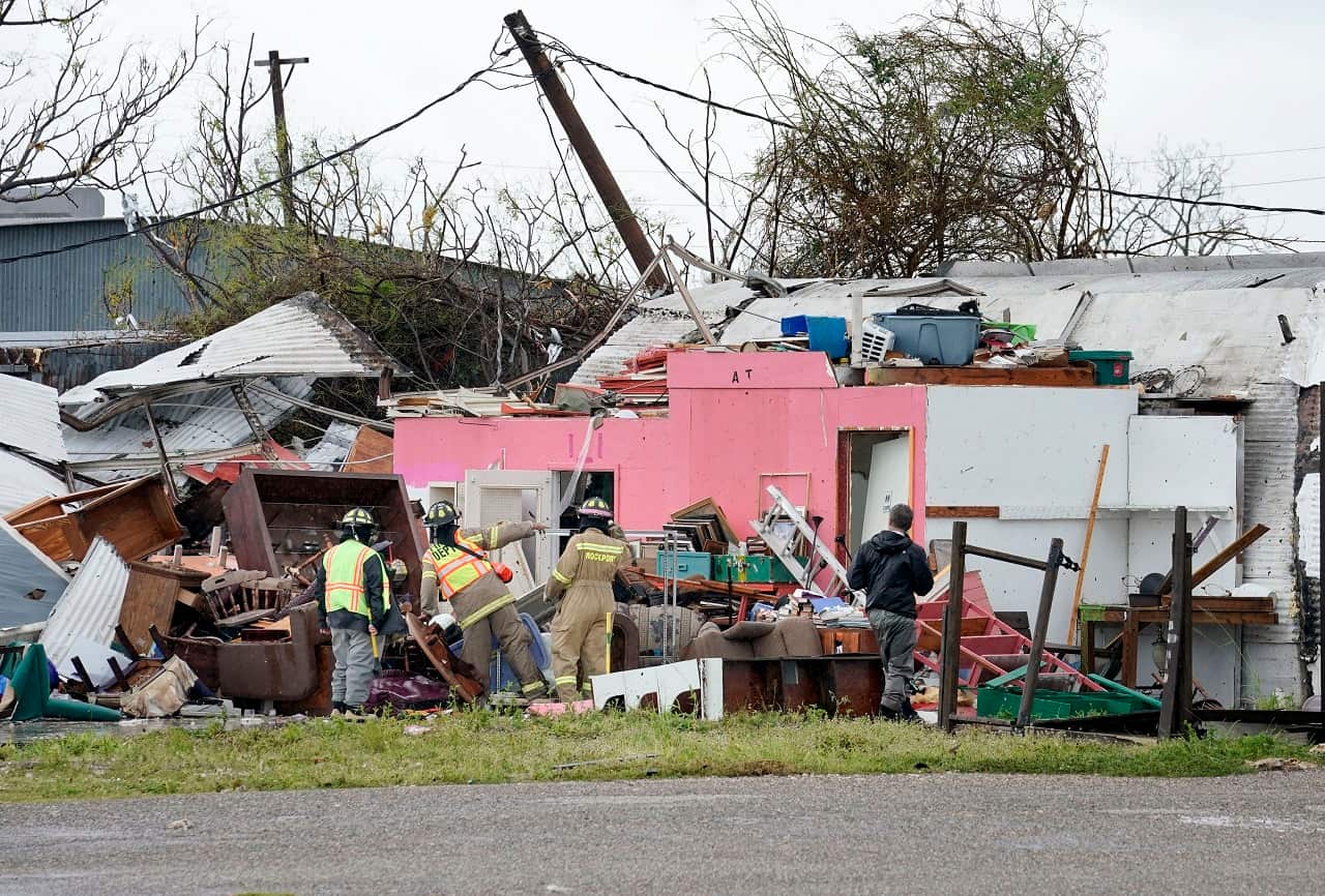 Rescue workers search for survivors in a structure damaged by Hurricane Harvey in Rockport, Texas,  26 August 2017.