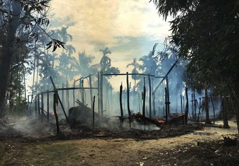 Smoke rises from a burned house in Gawdu Zara village, northern Rakhine state, Myanmar Thursday, September 7, 2017.