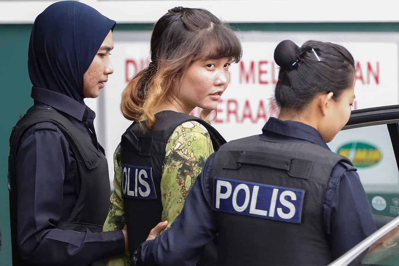 Vietnamese Doan Thi Huong, 28, who was detained in connection with the death of Kim Jong-Nam, is escorted by Malaysian police