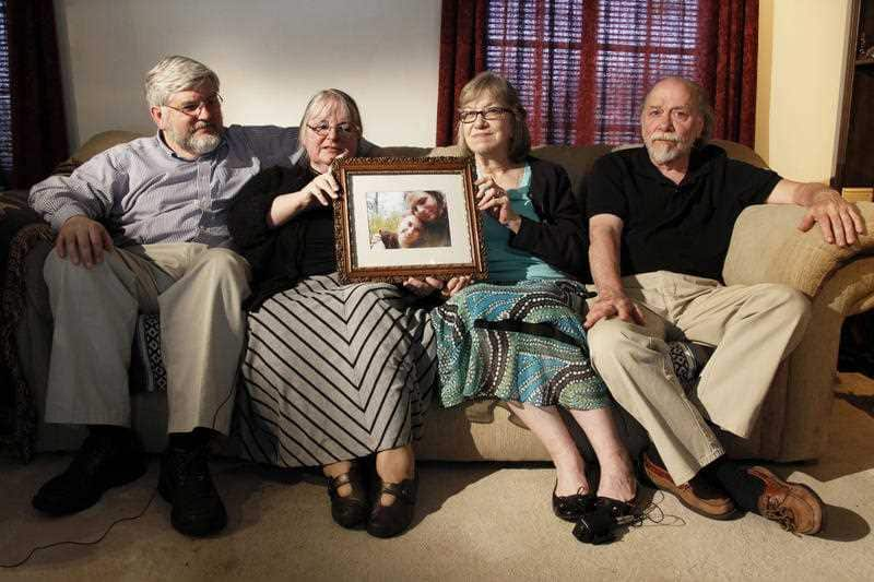 In this June 4, 2014, file photo, from left, Patrick Boyle, Linda Boyle, Lyn Coleman and Jim Coleman hold photo of their kidnapped children, Joshua Boyle and Caitlan Coleman, who were kidnapped by the Taliban in late 2012, Wednesday, June 4, 2014.