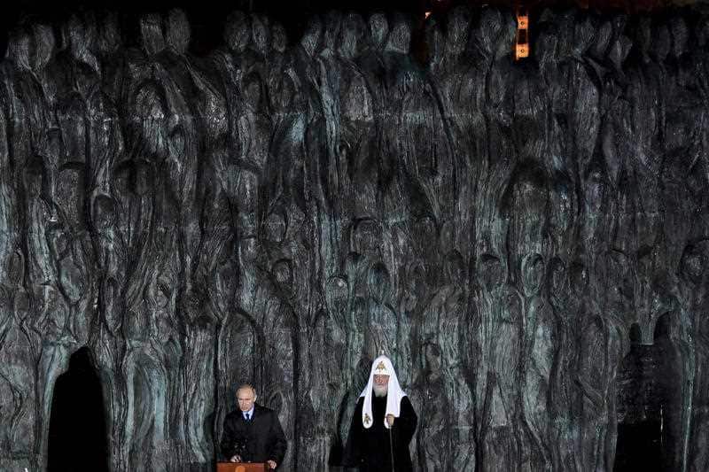 Russian President Vladimir Putin, left, and Orthodox Patriarch Kirill attend a ceremony unveiling the country's first national memorial to victims of Soviet-era political repressions called "The Wall of Grief" in Moscow, Russia, Monday, Oct. 30, 2017.