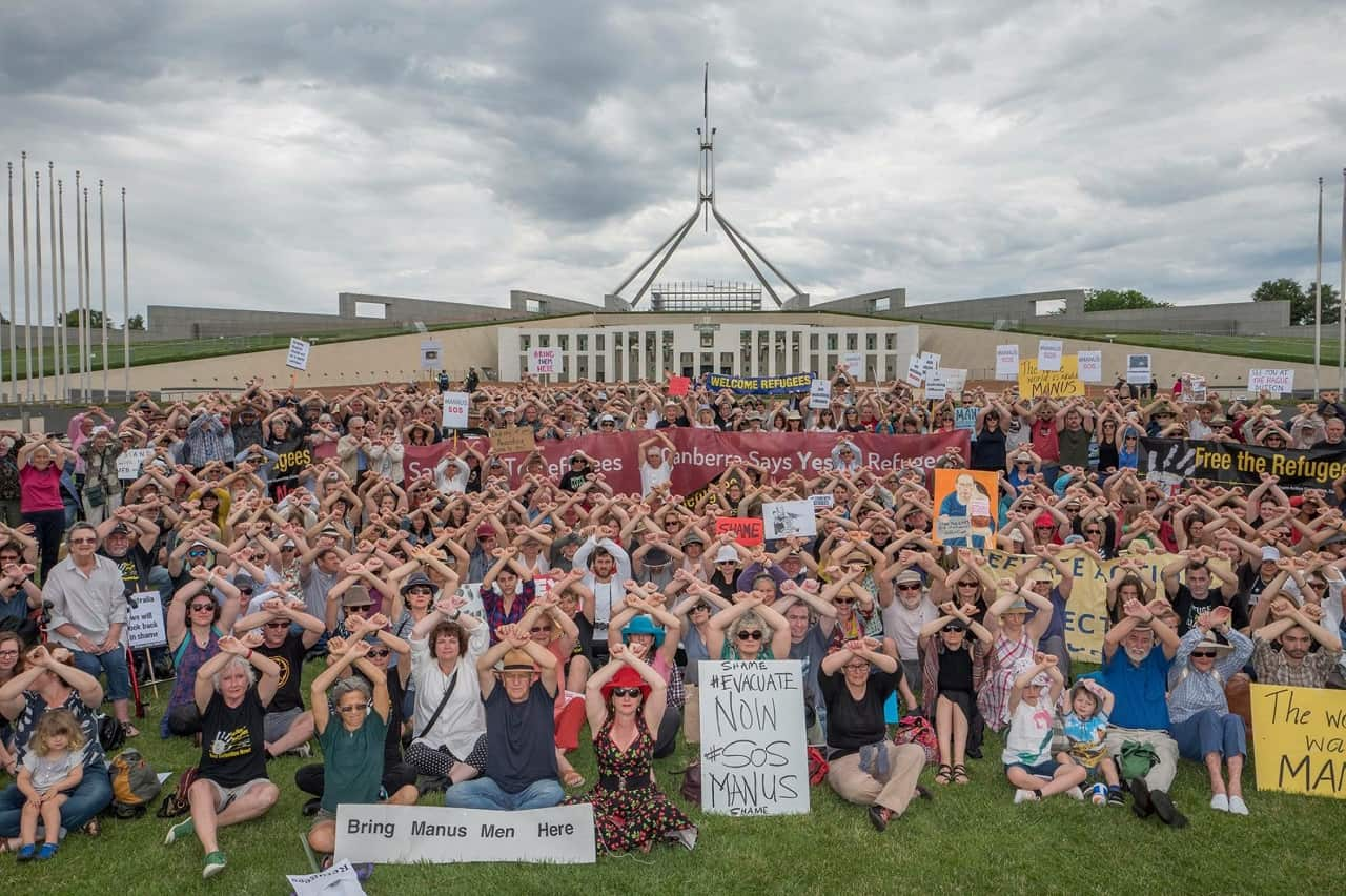 Protesters rallying against Australia's offshore detention centres outside Parliament House in Canberra, Sunday, November 26, 2017.