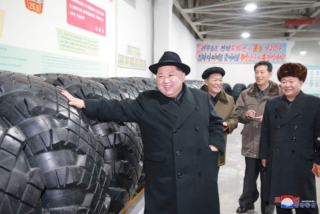 North Korean leader Kim Jong Un inspects a local tire factory.
