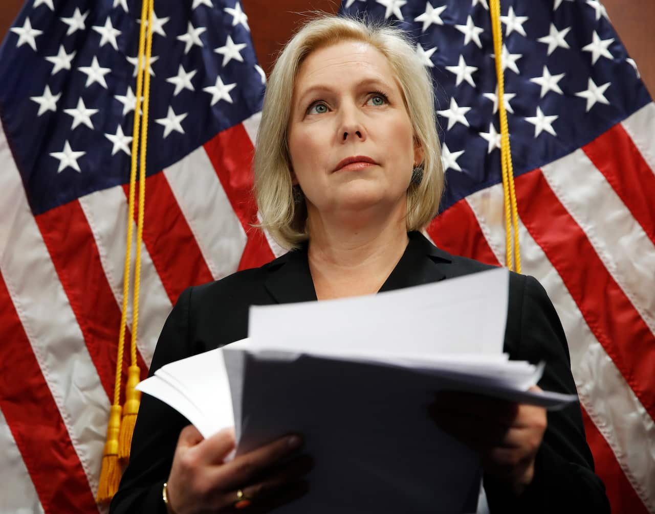 Senator Kirsten Gillibrand attends a news conference, Tuesday, Dec. 12, 2017, on Capitol Hill in Washington.