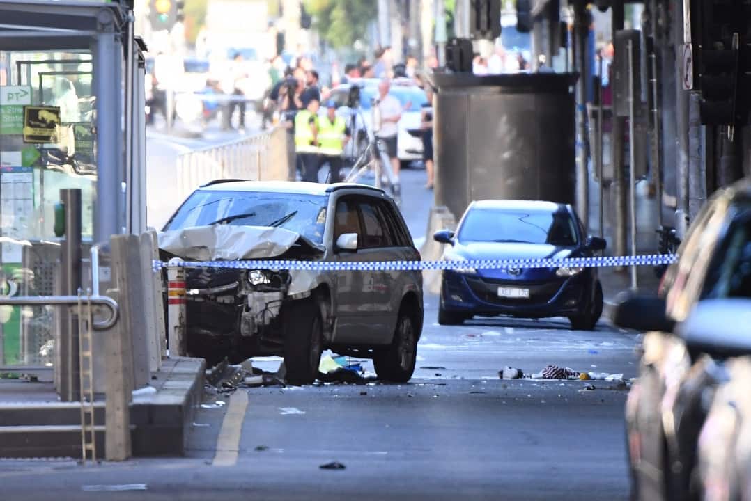 A damaged vehicle is seen at the scene of an incident on Flinders Street, in Melbourne, Thursday, December 21, 2017. 
