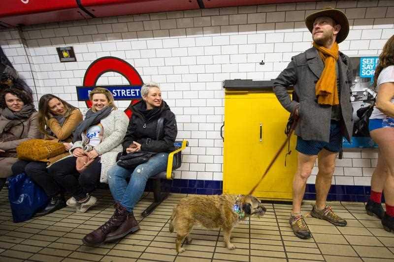 A man waits on the platform at Bond Street tube station as he takes part in No Trousers on the Tube day, in London.