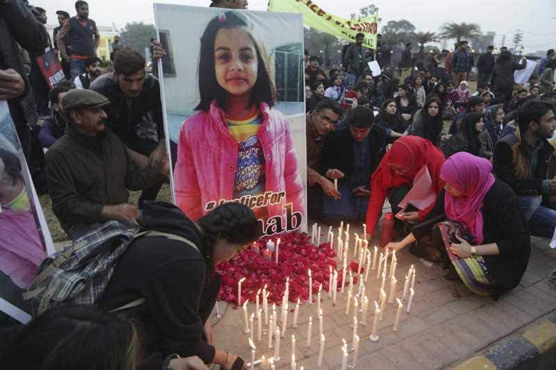 Pakistani students light candles during a protest rally to condemn the rape and killing of Zainab Ansari, an 8-year-old girl, last week in Kasur, Thursday, January 11, 2018, in Lahore, Pakistan.
