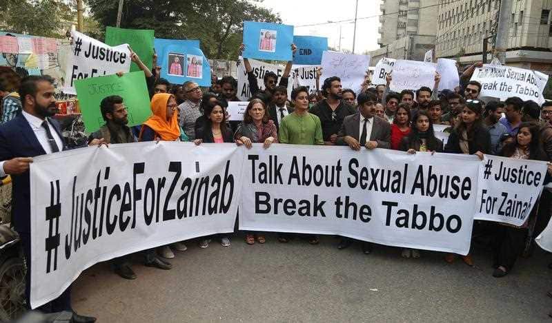 People hold banners and shout slogans during a protest against the rape and murder of a minor girl in Kasur, in Karachi, Pakistan, 11 January 2018.