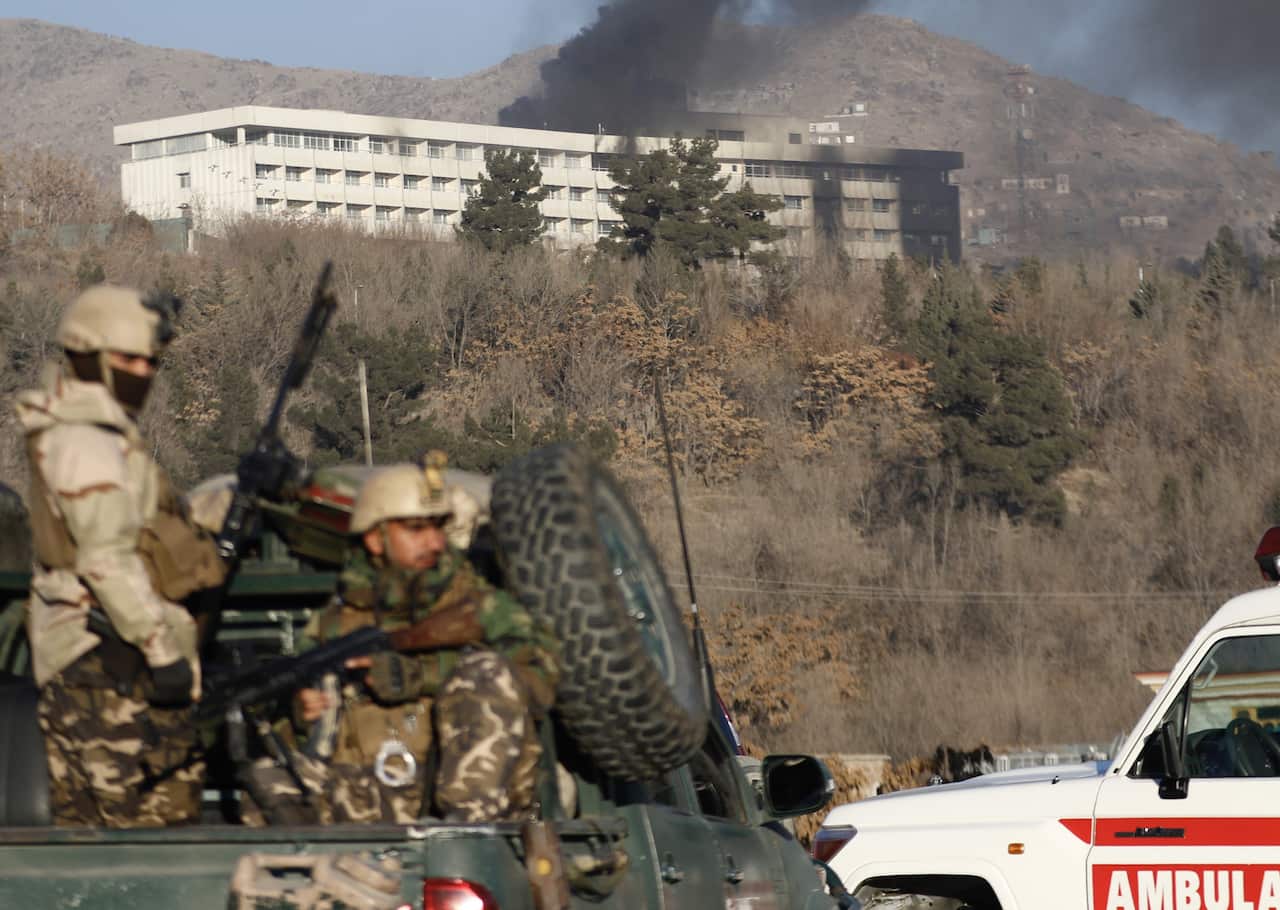 Smoke billows from the InterContinental hotel after an attack by armed gunmen in Kabul.