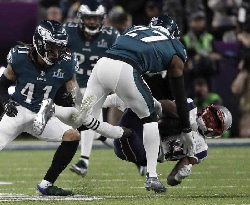 New England Patriots wide receiver Brandin Cooks (R) is hit by Philadelphia Eagles strong safety Malcolm Jenkins (2R) during the second quarter of Super Bowl LII.