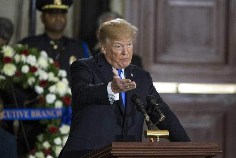 President Donald Trump speaks during ceremonies as the late Rev Billy Graham lies in honor in the Rotunda of the U.S. Capitol building