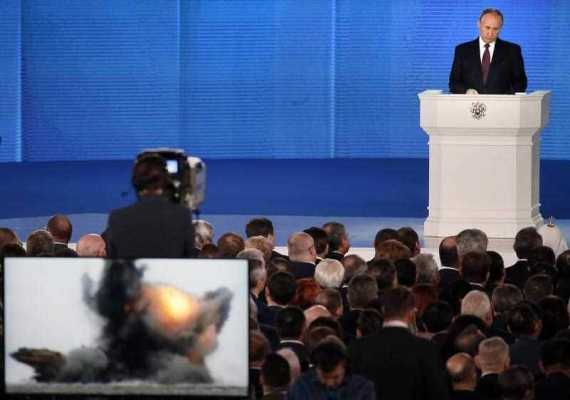 Russian President Vladimir Putin delivers his annual address to the Federal Assembly at the Manezh Central Exhibition Hall in Moscow, Russia.