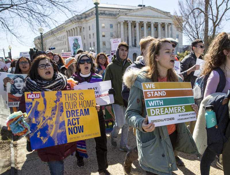 Deferred Action for Childhood Arrivals (DACA) recipients and other young immigrants march with supporters as they arrive at the Capitol in Washington.