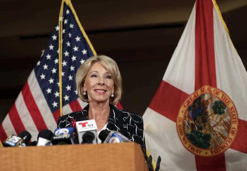 Secretary of Education Betsy DeVos speaks at a news conference following a visit to Marjory Stoneman Douglas High School.