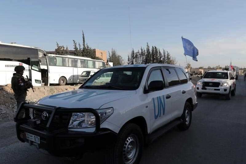 United Nations vehicles drive out of the Eastern Ghouta in the countryside of Damascus, Syria