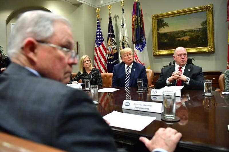 US President Donald J. Trump (C) holds a law enforcement roundtable on sanctuary cities, in the Roosevelt Room at the White House on in Washington.