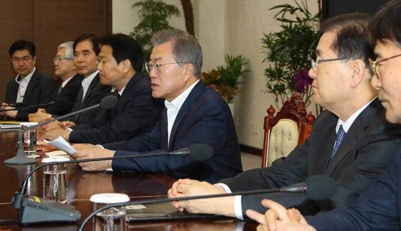 President Moon Jae-in (3-R) speaks during a meeting, regarding the upcoming between North and South Korea, at his office in Seoul.