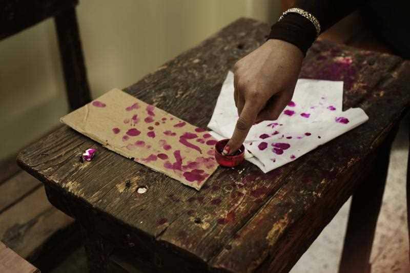 Egyptian voter gets finger marked with ink after voting at a polling station during the final day of the Egyptian presidential election in Cairo, Egypt.