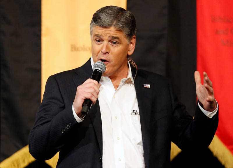 In this March 18, 2016 file photo, Fox News Channel's Sean Hannity speaks during a campaign rally for Republican presidential candidate, Sen. Ted Cruz, R-Texas, in Phoenix.