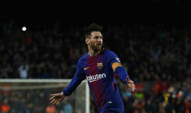Lionel Messi celebrating in a Barcelona jersey.