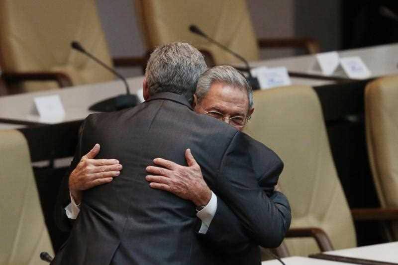  First Secretary of Cuba's Communist Party and now former president Raul Castro (R) holds the arm of new president Miguel Diaz-Canel (L) in Havana, Cuba,