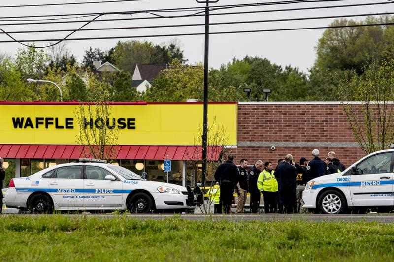 Police officials investigate at the scene of a shooting at a Waffle House Restaurant in Nashville, Tennessee, USA, 22 April 2018.