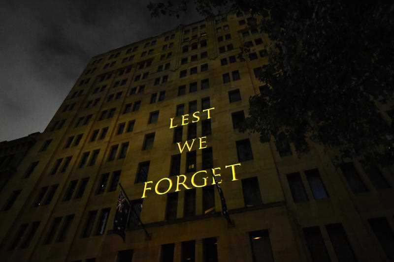 The words Lest We Forget are projected onto a building during the Anzac Day Dawn service at Martin Place in Sydney, Wednesday, April 25, 2018.