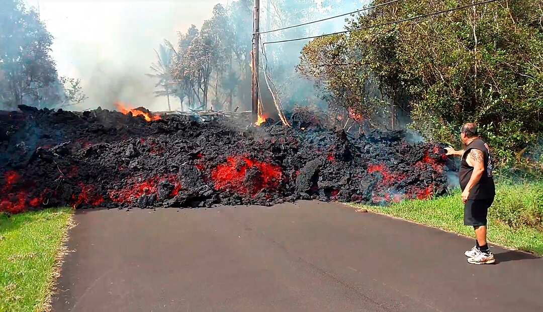 A lava flow advances down a road in the Leilani Estates, Hawaii.