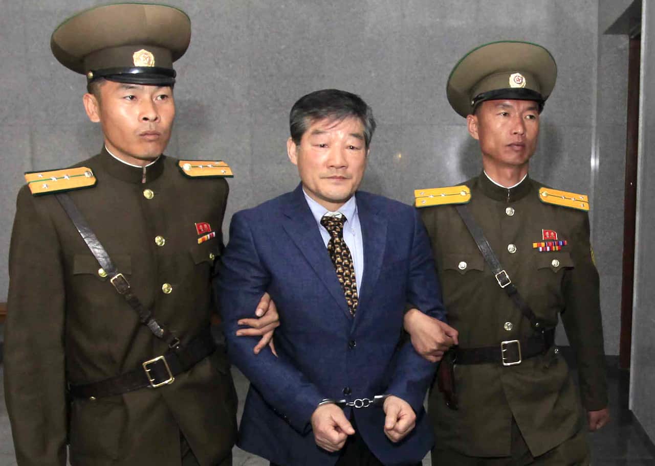 In this April 29, 2016, file photo, Kim Dong Chul, center, a US citizen detained in North Korea, was freed.